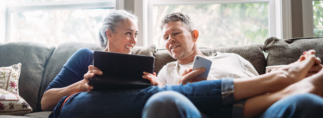 Older couple on a couch - Upstart Personal Loans