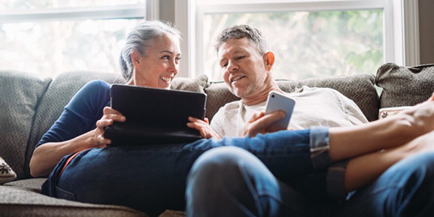 Older couple on a couch - Upstart Personal Loans