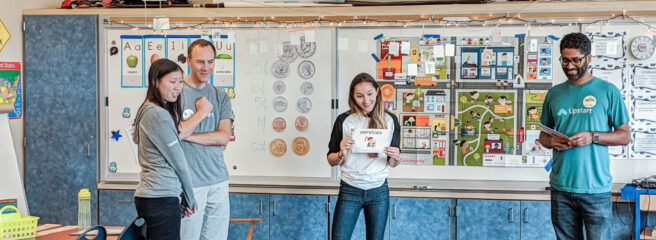 Upstart teachers talking to a group of students - Upstart Personal Loans