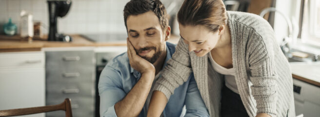 Photo of a young couple calculating home finances