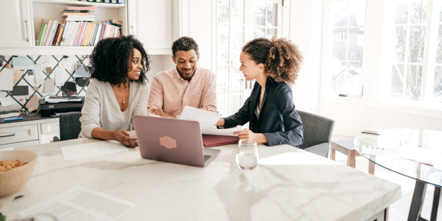 3 People Looking Over Paperwork - Upstart Personal Loans