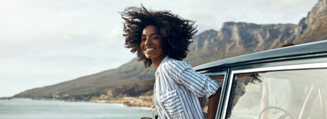 Woman hanging outside a car window - Upstart Personal Loans