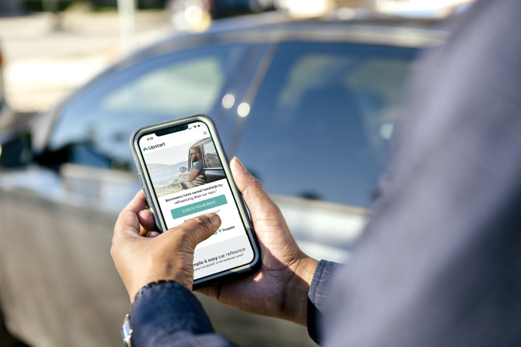 Man going on Upstart auto refi landing page to check his rate