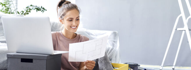 Woman planning DIY home projects and researching home improvement loans on laptop.