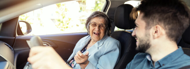 A man drives a car while a woman sits in the passenger seat and considers becoming a co-signer