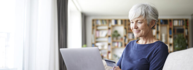 A woman uses her laptop to prequalify for an online personal loan