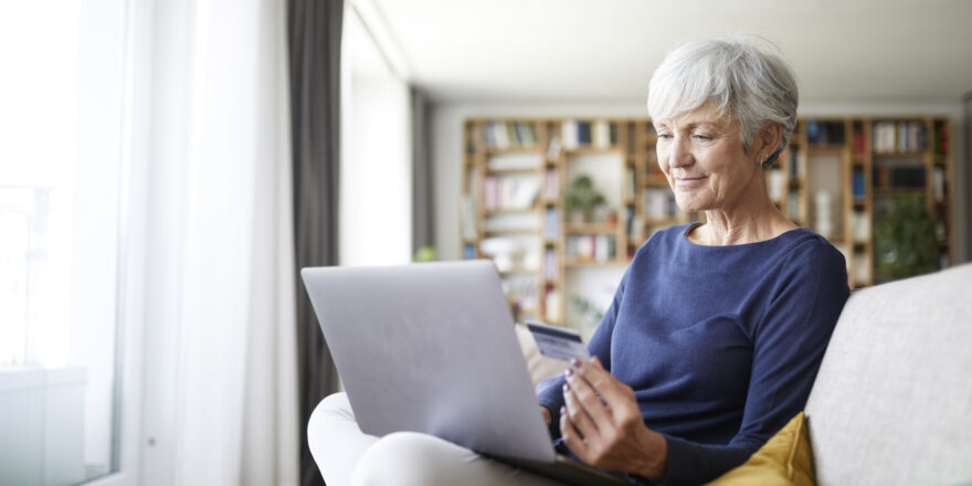 A woman uses her laptop to prequalify for an online personal loan