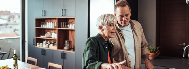 Mature couple in a kitchen talking about financing a kitchen remodel