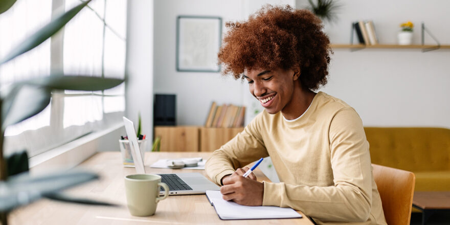 Young adult African American learning about personal loan prequalification at a desk