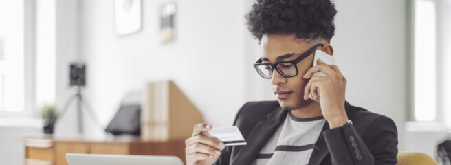 Man looking up credit card information