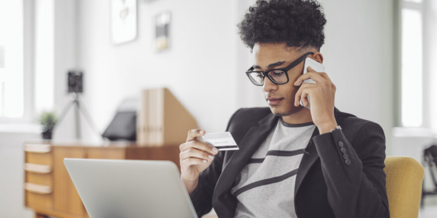 Man looking up credit card information