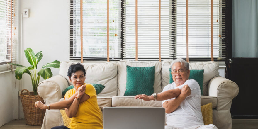 Senior workout exercise and doing yoga at home