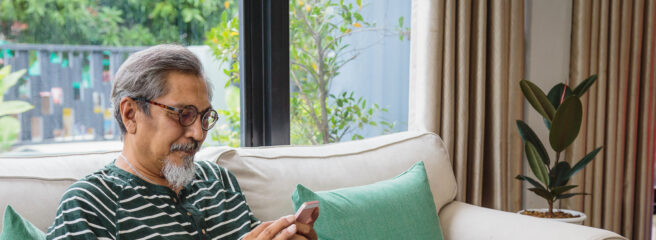 Portrait of man learning about unsecured loans on his smartphone