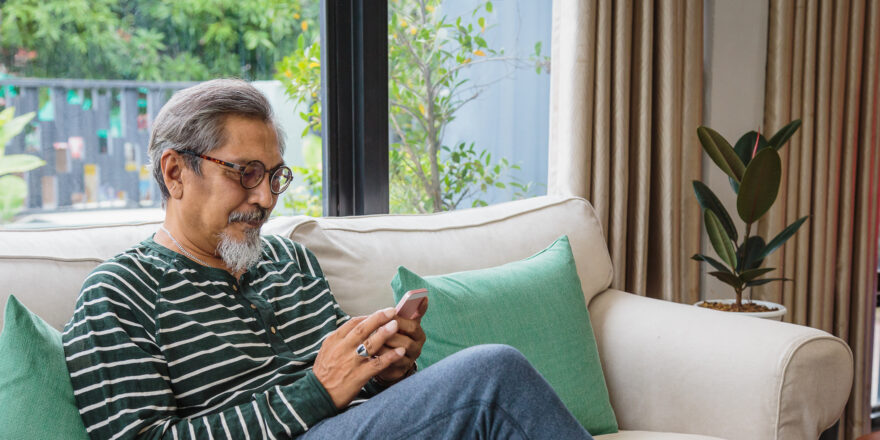 Portrait of man learning about unsecured loans on his smartphone