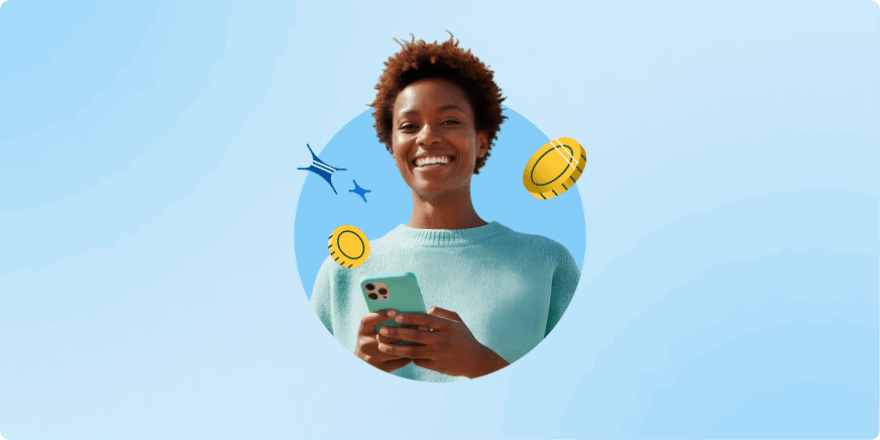 A woman holding a phone smiling