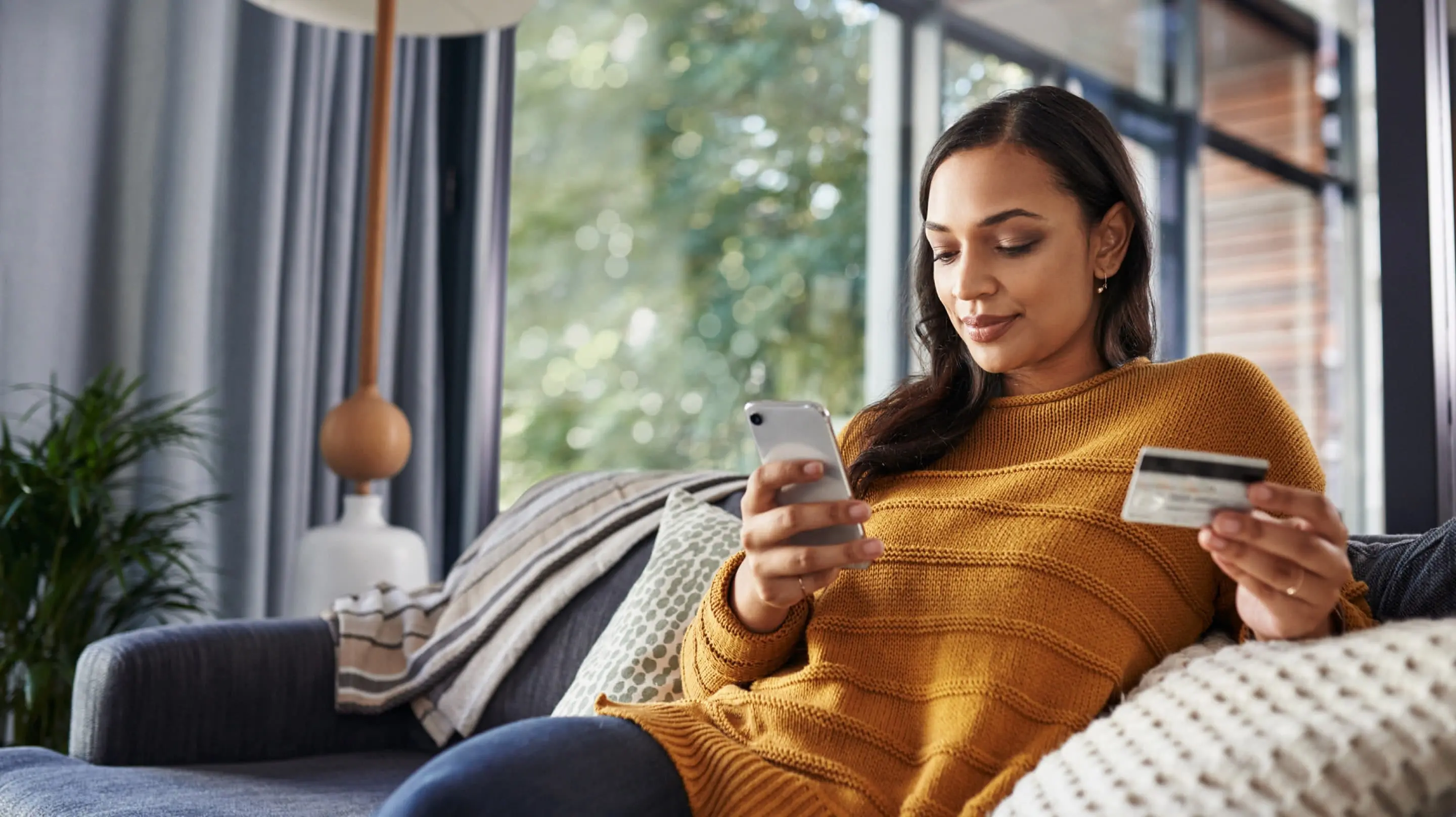 Female checking her rate for an Upstart credit card consolidation loan