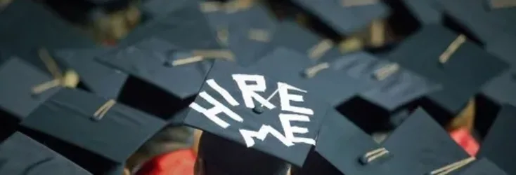 College student with “Hire Me” on his hat - Upstart Personal Loans