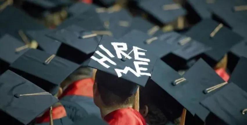 College student with “Hire Me” on his hat - Upstart Personal Loans
